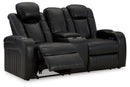 Caveman Den - Power Reclining Loveseat with Console/ Adj Hdrst - Midnight
